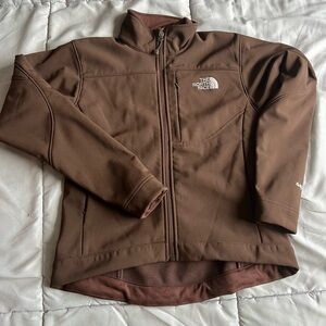 This is a brown North Face jacket for women. The size is an xs.